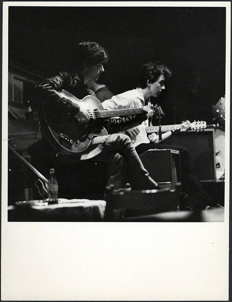 Paul McCartney and George Harrison Circa 1960 Vintage Stamped Photograph by Astrid Kirchherr