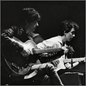 Paul McCartney and George Harrison Circa 1960 Vintage Stamped Photograph by Astrid Kirchherr