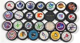 Lot of 27 Signed NHL Hockey Pucks Featuring Wayne Gretzky