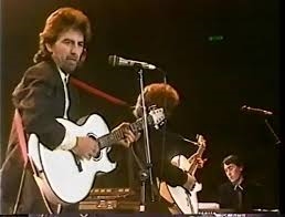 George Harrison Stage Played Washburn Acoustic Guitar During Prince’s Trust All-Star Rock Concert On 10/13/1987 For Iconic Here Comes the Sun Performance (RGU)