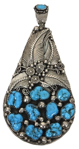 Elvis Presley Owned and Worn Sterling Silver Double-Sided Turquoise and Coral Pendant